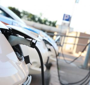 EV charger plugged into vehicle