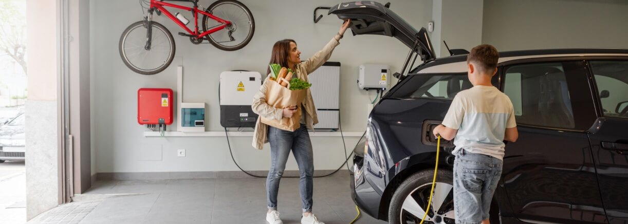 family charging their EV in their garage