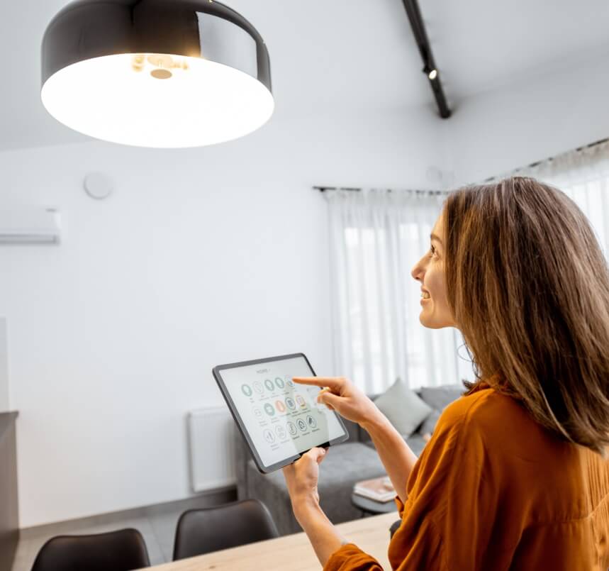 Woman enjoying her smart lights after a lighting retrofit